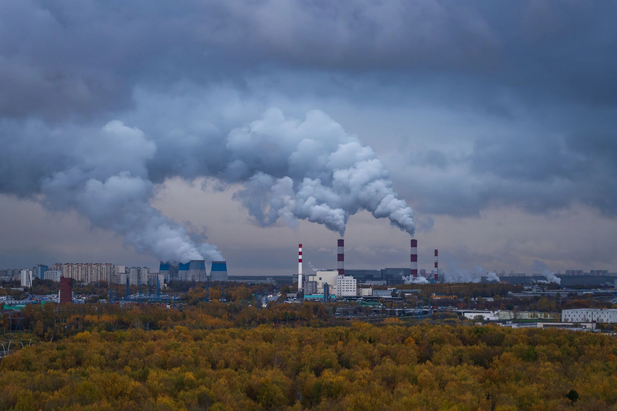 Industrial skyline and atmosphere representing air quality and environmental context.
