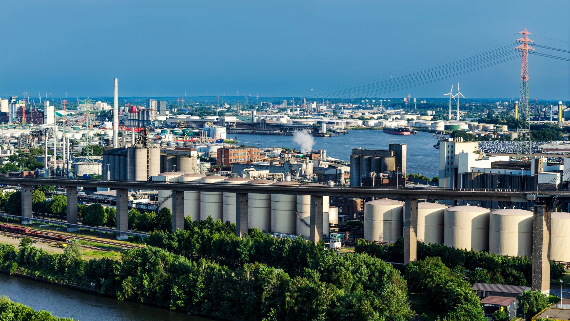 Aerial view of an industrial harbor representing industrial projects and clean-air outcomes.